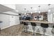 Finished basement bar features seating, shelving, pendant lights, and TV, perfect for entertaining guests at 4642 Big Run Ct, Indianapolis, IN 46239