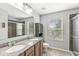 Bathroom features granite countertops, dual sinks, a large mirror, and a separate shower and toilet area at 4642 Big Run Ct, Indianapolis, IN 46239