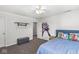 Bright bedroom features carpet, a ceiling fan, neutral walls and Captain America decor at 4642 Big Run Ct, Indianapolis, IN 46239