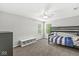 Neutral bedroom with carpet, two windows, a ceiling fan, and bunk beds, perfect for children or guests at 4642 Big Run Ct, Indianapolis, IN 46239