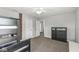 Bedroom features carpet, a ceiling fan, a glimpse into the hallway, and a storage dresser at 4642 Big Run Ct, Indianapolis, IN 46239