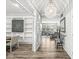 Inviting entryway featuring a decorative chandelier and seamless transition into a spacious living area with wood flooring at 4642 Big Run Ct, Indianapolis, IN 46239