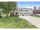 Charming two-story home featuring a three-car garage and a well-manicured front lawn at 4642 Big Run Ct, Indianapolis, IN 46239