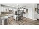 Elegant kitchen with stainless steel appliances, kitchen island with barstool seating, and ample cabinetry and countertops at 4642 Big Run Ct, Indianapolis, IN 46239