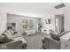 Spacious living room with plush sofas, neutral colors, and natural light at 4642 Big Run Ct, Indianapolis, IN 46239