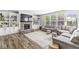 Comfortable living room showcasing a stone fireplace, built-in shelving, and ample natural light at 4642 Big Run Ct, Indianapolis, IN 46239
