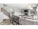 Cozy living room displaying a stone fireplace, custom shelving, and stylish decor with a smooth transition to stairway at 4642 Big Run Ct, Indianapolis, IN 46239