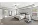 Spacious main bedroom featuring a tray ceiling, neutral tones, and a dedicated workout area at 4642 Big Run Ct, Indianapolis, IN 46239