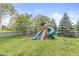 Backyard featuring a charming wooden playset, perfect for Gathering fun and entertainment at 4642 Big Run Ct, Indianapolis, IN 46239