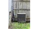 Exterior view of the AC unit, sitting in mulch outside of the home at 509 Shelby St, Shelbyville, IN 46176