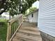 Exterior view of a wood back deck with access to a back yard at 509 Shelby St, Shelbyville, IN 46176