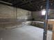 Spacious unfinished basement, ideal for storage or future renovation, with concrete flooring at 509 Shelby St, Shelbyville, IN 46176