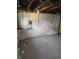 Unfinished basement with exposed pipes and concrete floor, ready for customization at 509 Shelby St, Shelbyville, IN 46176