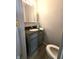 Charming bathroom features a vanity sink and toilet at 509 Shelby St, Shelbyville, IN 46176