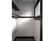 A closet featuring neutral walls, dark trim, comfortable carpeting, and a clothing bar at 509 Shelby St, Shelbyville, IN 46176