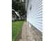 Exterior view of the home's foundation, siding and a sidewalk at 509 Shelby St, Shelbyville, IN 46176