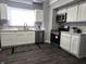 Well-lit kitchen with new appliances, white countertops, and modern cabinets at 509 Shelby St, Shelbyville, IN 46176