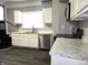 Kitchen showcases stainless steel appliances, marbled countertops, and modern white cabinetry at 509 Shelby St, Shelbyville, IN 46176