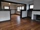 Bright living room boasts beautiful hardwood floors, a fireplace, and stylish dark trim, creating a warm atmosphere at 509 Shelby St, Shelbyville, IN 46176