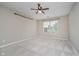 Cozy bedroom featuring plush carpeting, a large window for natural light, and neutral paint for a relaxing ambiance at 5258 Brassie Dr, Indianapolis, IN 46235