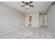 Spacious bedroom featuring plush carpeting and a ceiling fan at 5258 Brassie Dr, Indianapolis, IN 46235