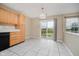 Bright eat-in kitchen area with ample cabinet space and sliding glass doors that open to the backyard at 5258 Brassie Dr, Indianapolis, IN 46235