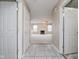 Inviting entryway with tile flooring leading into a spacious living room featuring a cozy fireplace at 5258 Brassie Dr, Indianapolis, IN 46235