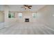 Bright living room features a fireplace and large windows that provide natural light and scenic views at 5258 Brassie Dr, Indianapolis, IN 46235