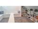 Cozy attic room featuring a built-in bench and shelving for storage and display at 5315 Camden St, Indianapolis, IN 46227