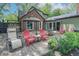 Backyard featuring green lawn, patio, mature trees, and outdoor furniture at 5315 Camden St, Indianapolis, IN 46227