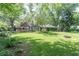 Lush backyard with a fire pit and outdoor seating area for entertaining at 5315 Camden St, Indianapolis, IN 46227
