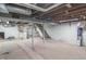 Unfinished basement with exposed pipes and support beams; great for storage or future remodeling at 5315 Camden St, Indianapolis, IN 46227