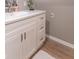 Bathroom featuring white vanity cabinet, white vessel sink, and brushed metal hardware at 5315 Camden St, Indianapolis, IN 46227