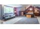 Spacious attic bedroom with sitting area, canopy bed and ample natural light at 5315 Camden St, Indianapolis, IN 46227