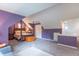 Spacious attic bedroom with sitting area, canopy bed and ample natural light at 5315 Camden St, Indianapolis, IN 46227