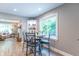 Bright dining area with a marble-topped table and views into the living room at 5315 Camden St, Indianapolis, IN 46227