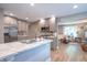 Modern kitchen with stainless steel appliances, marble counters, and hardwood floors at 5315 Camden St, Indianapolis, IN 46227