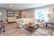 Inviting living room with a comfortable sofa, stylish decor, and ample natural light from the large window at 5315 Camden St, Indianapolis, IN 46227