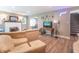 Open living room with a fireplace, comfortable sofa, television, and staircase access at 5315 Camden St, Indianapolis, IN 46227