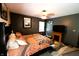 Inviting bedroom with a fireplace, a TV, dark wood furnishings, and a ceiling fan at 5654 Paradise Dr, Martinsville, IN 46151