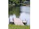 Private dock on a serene lake provides direct access to the water for recreation and relaxation at 5654 Paradise Dr, Martinsville, IN 46151