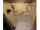 A clean shower stall features built-in shelving and a grab bar for safety and convenience at 5654 Paradise Dr, Martinsville, IN 46151