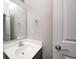 Well-lit bathroom with a large mirror, modern fixtures and white door at 5677 Brownstone Dr # 5677, Indianapolis, IN 46220