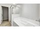 Bathroom showcasing a glass enclosed shower and a soaking tub at 5677 Brownstone Dr # 5677, Indianapolis, IN 46220