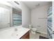 Bathroom with a tiled floor, vanity sink, and a shower-tub combo at 5677 Brownstone Dr # 5677, Indianapolis, IN 46220