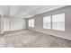 Spacious bedroom with neutral walls, plush carpet, and large windows at 5677 Brownstone Dr # 5677, Indianapolis, IN 46220