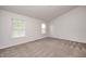 Bedroom with neutral walls, carpeted floors, and bright, naturally lit windows at 5677 Brownstone Dr # 5677, Indianapolis, IN 46220