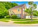 Beautifully landscaped yard surrounds this home, with an attached garage and driveway at 5677 Brownstone Dr # 5677, Indianapolis, IN 46220