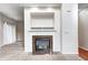Close-up of fireplace featuring white mantel and marble hearth, and natural light at 5677 Brownstone Dr # 5677, Indianapolis, IN 46220