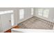 Bright two-story foyer with multiple windows and tile/carpet flooring at 5677 Brownstone Dr # 5677, Indianapolis, IN 46220